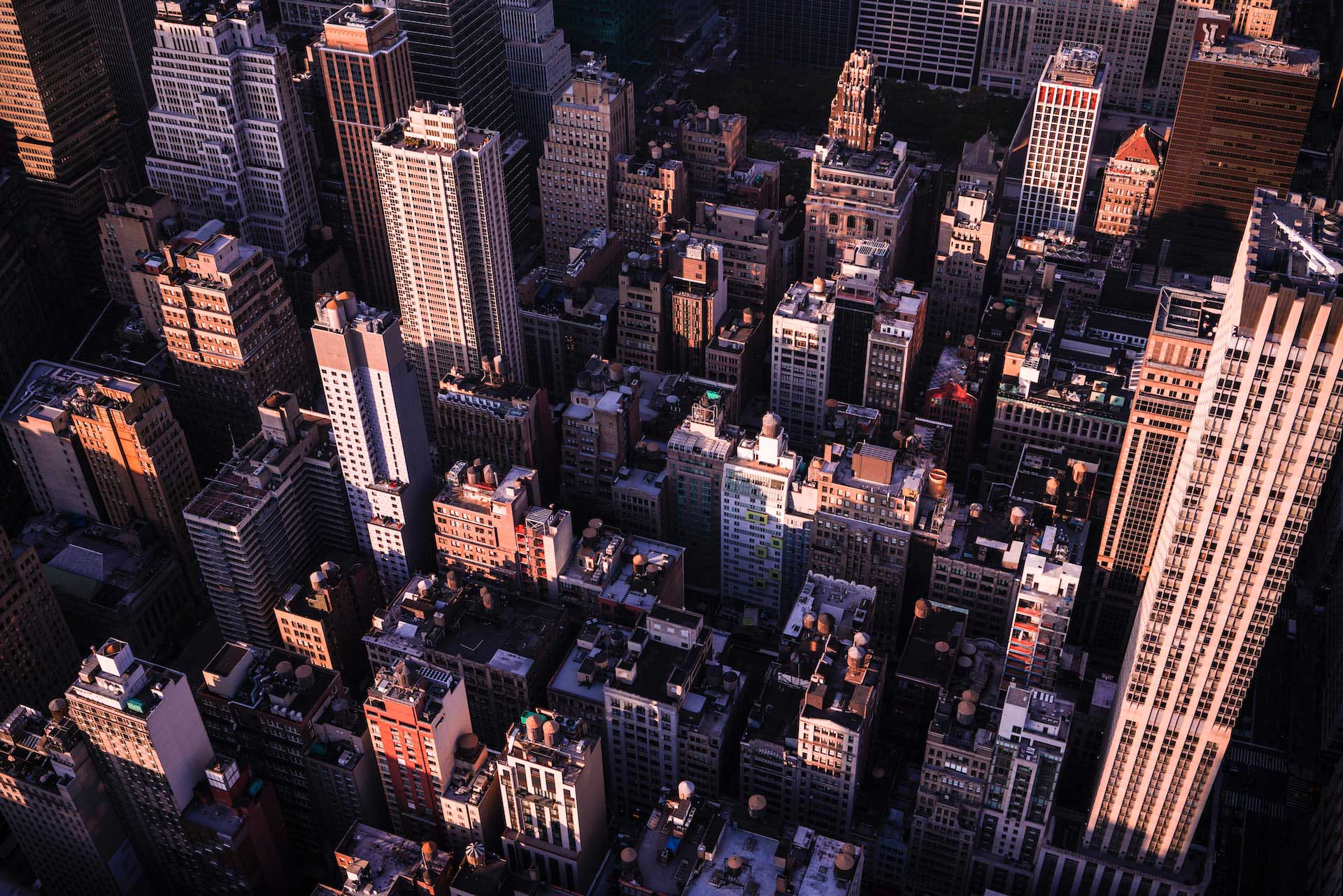 Sunlight falling across a dense city skyline